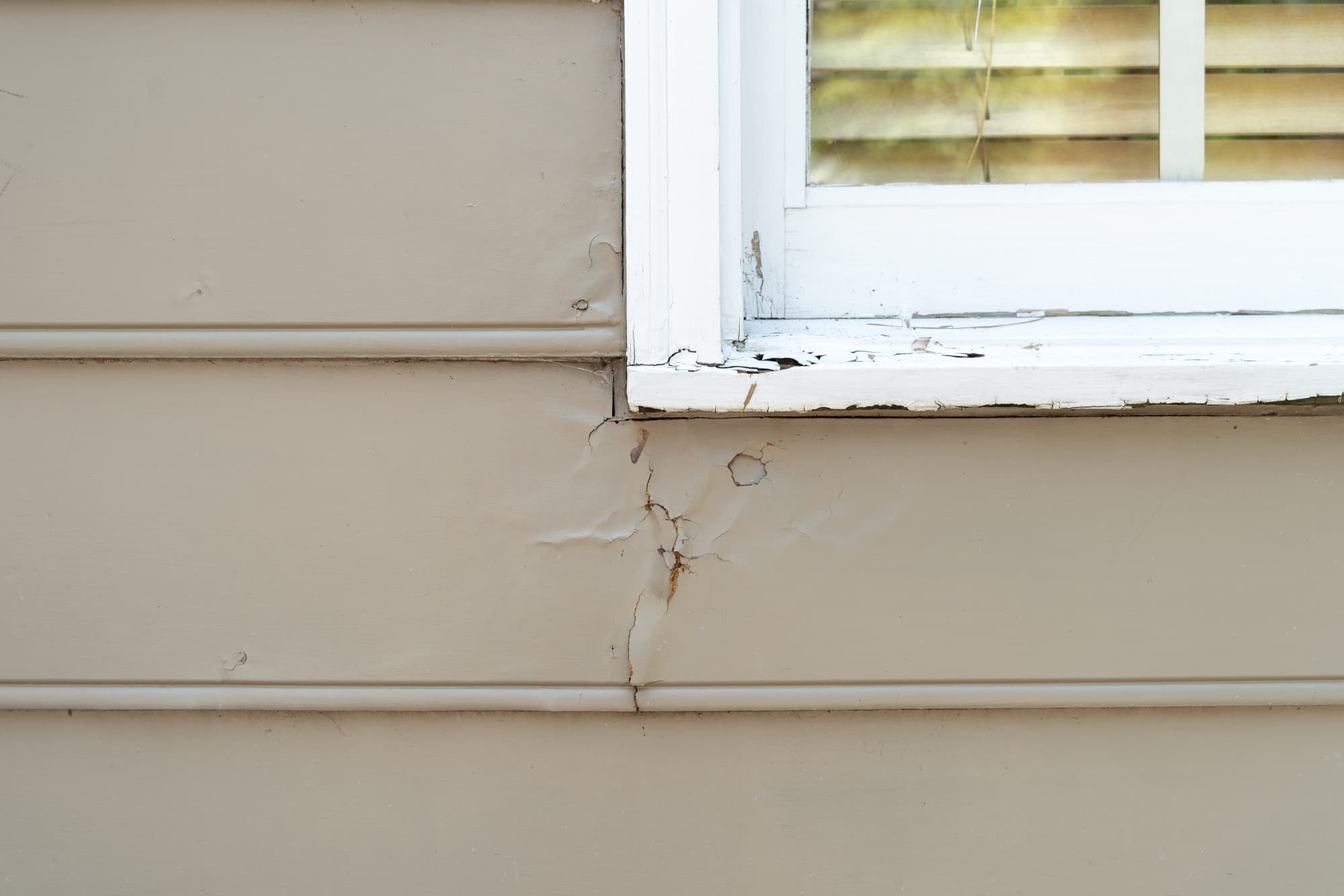 Decide to Re-side: Cracking paint and trim around a window Decide to Re-side: Cracking paint and trim around a window